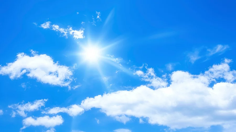 blue sky with some clouds and the sun blauer Himmel mit Sonne und Wolken