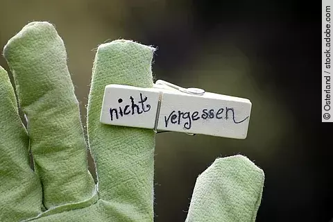 Klammer mit Schrift"nicht vergessen" Handschuh