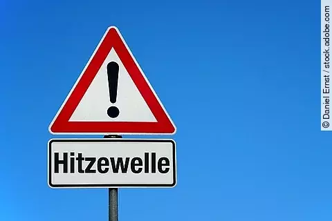 Hitzewelle mit Achtungschild