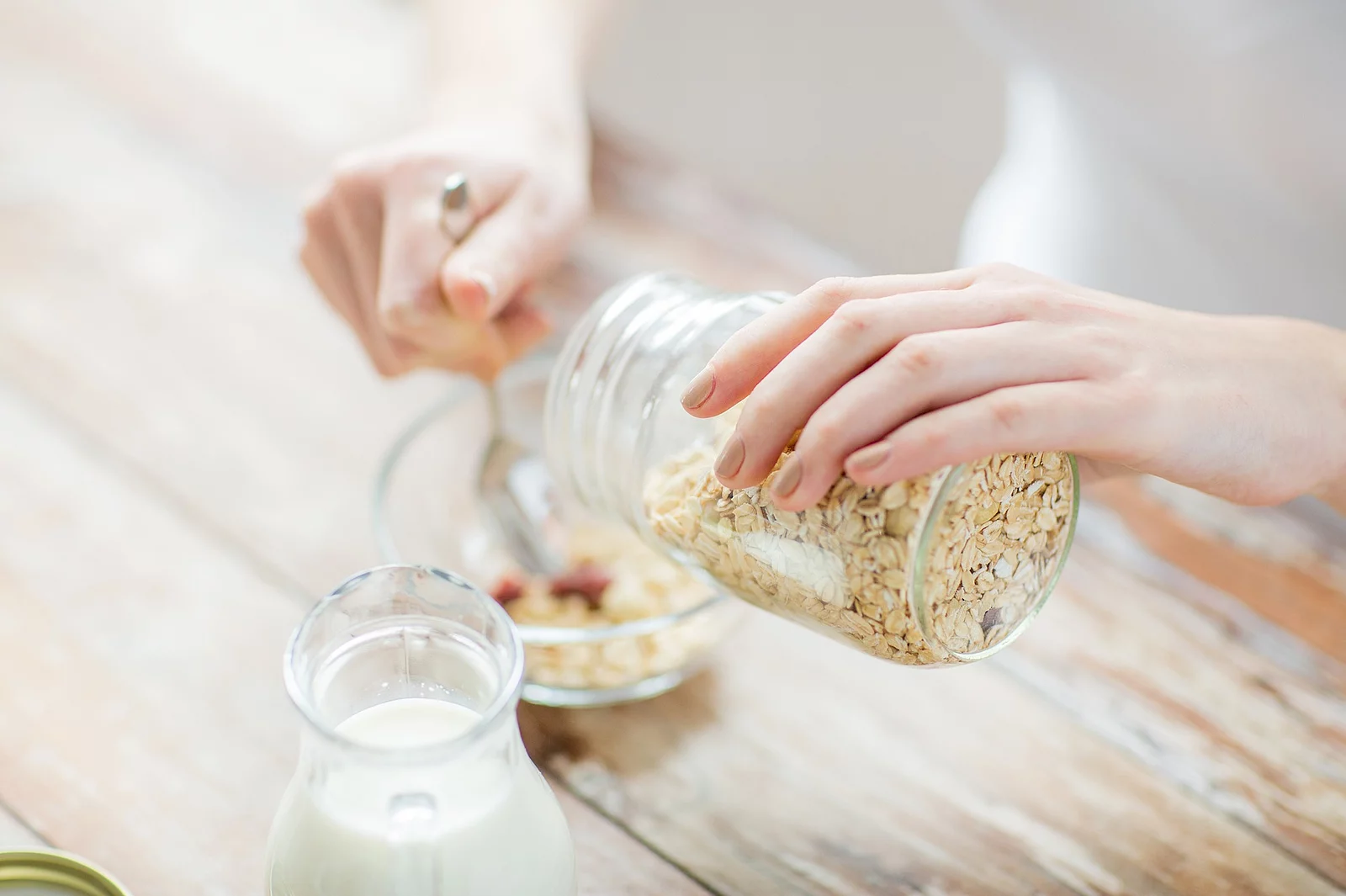 close up of woman eating muesli for breakfast