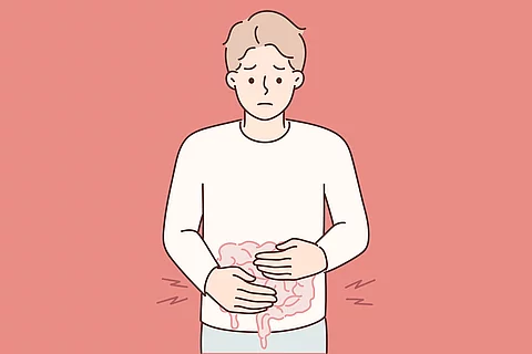 Zeichnung: Man/Junge legt die Hände auf den Bauch und verzieht das Gesicht.