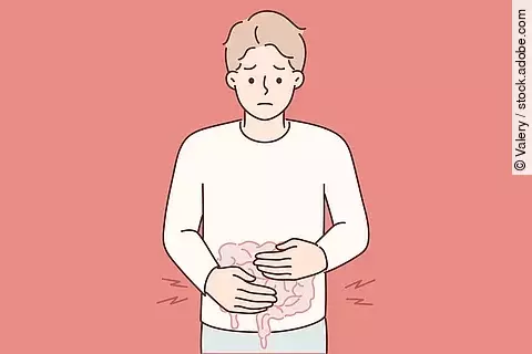 Zeichnung: Man/Junge legt die Hände auf den Bauch und verzieht das Gesicht.