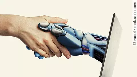 Handschlag einer KI-Hand aus Laptop heraus 