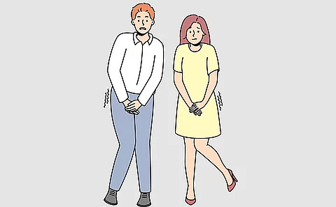 Karikatur von zwei Menschen, die sich die Blase halten