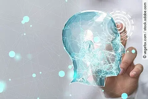 Eine Hand "klickt" einen grafischen Kopf an.