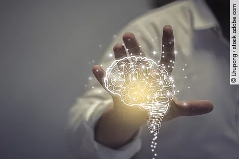 Grafik von einem leuchtenden Gehirn. 