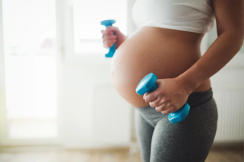 Pregnant woman taking care of her body during pregnancy