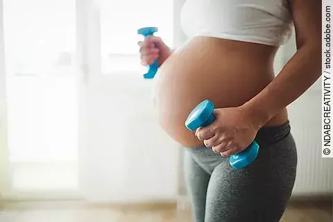 Pregnant woman taking care of her body during pregnancy