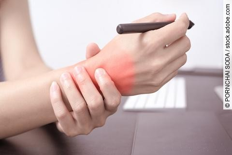 woman wrist arm pain long use pen mouse working. office syndrome