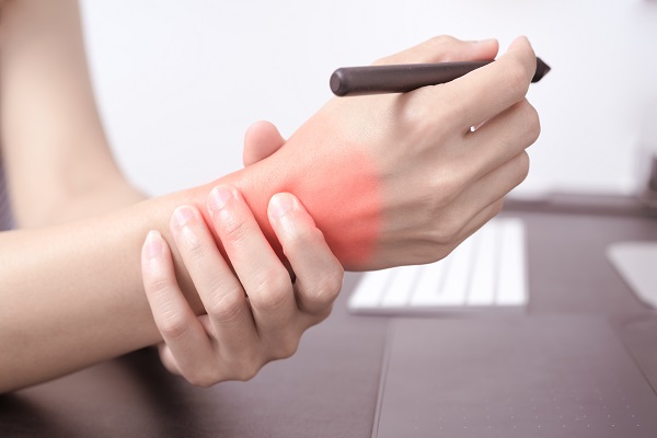 woman wrist arm pain long use pen mouse working. office syndrome