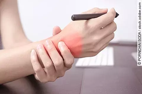 woman wrist arm pain long use pen mouse working. office syndrome