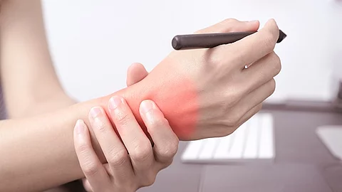 woman wrist arm pain long use pen mouse working. office syndrome