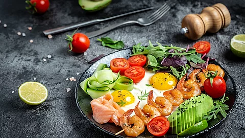 Ketogenic breakfast. Keto low carb salmon, grilled shrimps, praw
