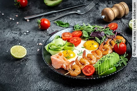 Ketogenic breakfast. Keto low carb salmon, grilled shrimps, praw