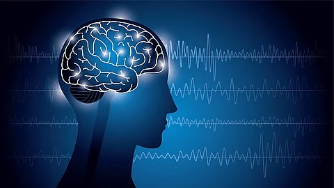 Illustration eines menschlichen Gehirns im Körper. Im Hintergrund sind EEG-Messwerte abgebildet.