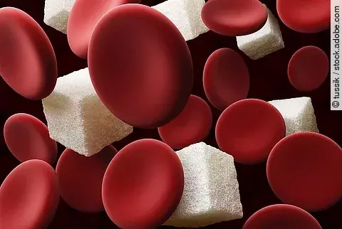Illustration: Blutzellen und Zuckerwürfel auf dunklem Hintergrund