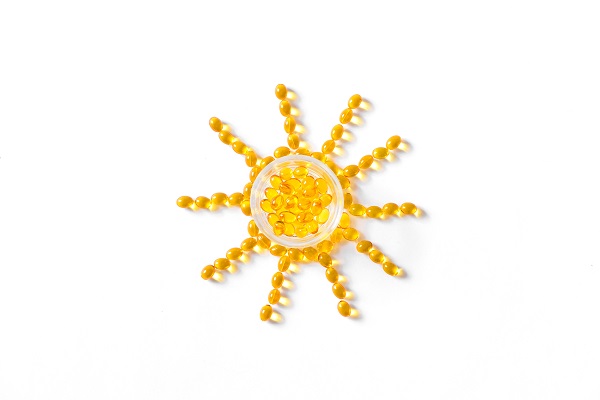 Sonne gelegt aus Vitamin-D-Kapseln